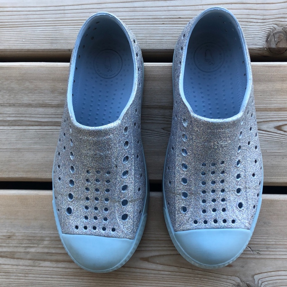 Native C13 blue sparkle slip on shoes.